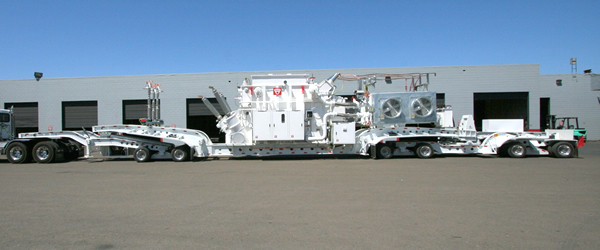 Modified Cozad 9-Axle steerable trailer with permanently mounted transformer